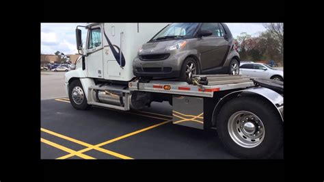 Semi Truck With Tiny Car Mounted Youtube