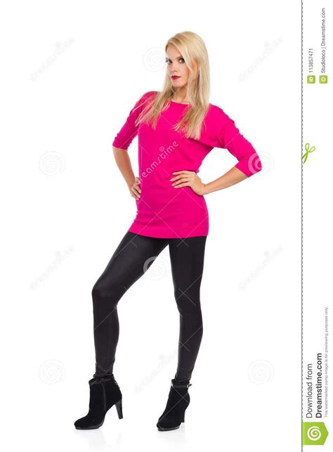 Serious Fashion Model Is Standing With Hands On Hip And Looking At