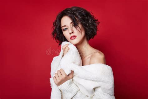 Naked Woman With Short Hair Girl Posing In A White Jacket On A Red