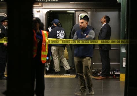 woman thrown in front of train at times square subway station is killed