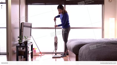 housewife maid asian housemaid doing chores working cleaning bedroom