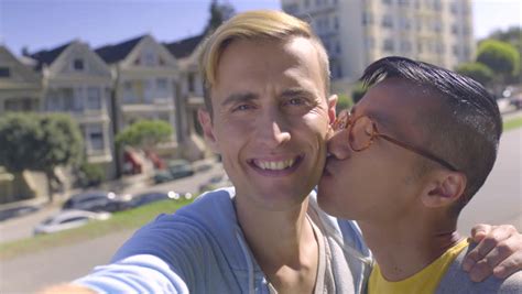Cute Gay Couple Take A Selfie Together On A Rooftop At