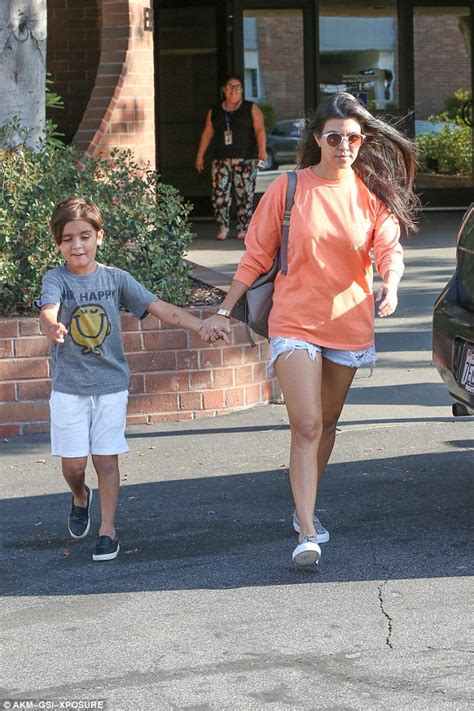 Kourtney Kardashian Flashes Her Toned Legs In Cut Off Shorts With Mr