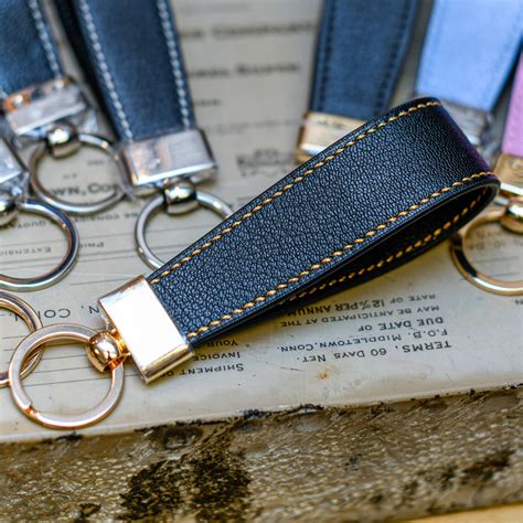 black leather key ring holder gold stitching long handle design