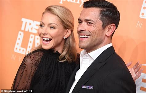 kelly ripa dazzles in black gown with sheer sleeves as she arrives with husband mark consuelos