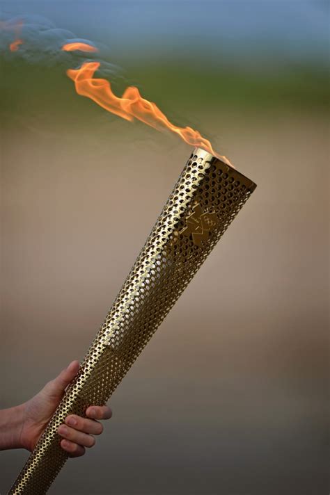 olympic torch carries  flame  london  nbc news