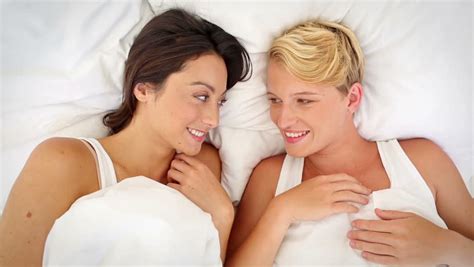 lesbian couple cuddling in bed stock footage video 100 royalty free