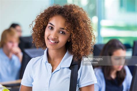 beautiful african american teen girl in private high school classroom