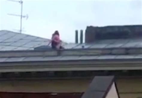 raunchy couple risk their lives to have public sex on sloped rooftop of