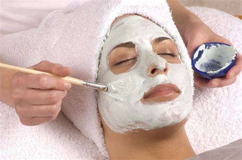 spa facial mask application young woman  day spa salon  full