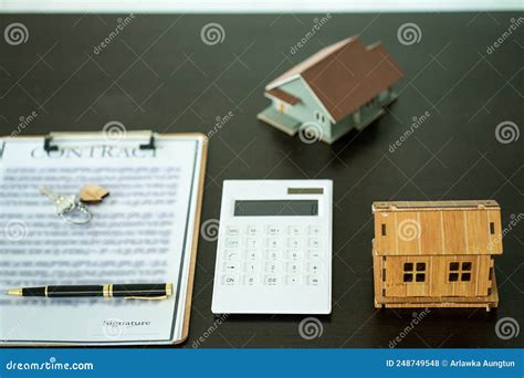 houses calculator contract documents keys  pens   desk house sale ideas stock
