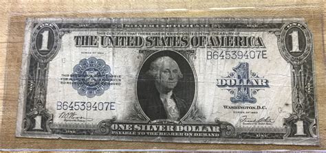 dollar note  silver certificate  au blue seal bill