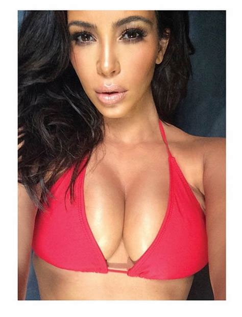 kim kardashian shows off pin up figure in skimpy bikini