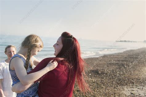 Lesbian Couple And Daughter On Beach Stock Image F023 0076