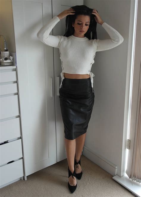 amateur in black leather skirt white sweater and ankle strap heels latex and leather