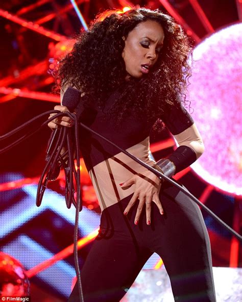 kelly rowland shows off a very rounded posterior in skintight catsuit