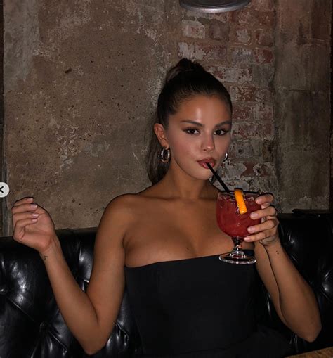 selena gomez shows off sexy cleavage in a black tube top — pics