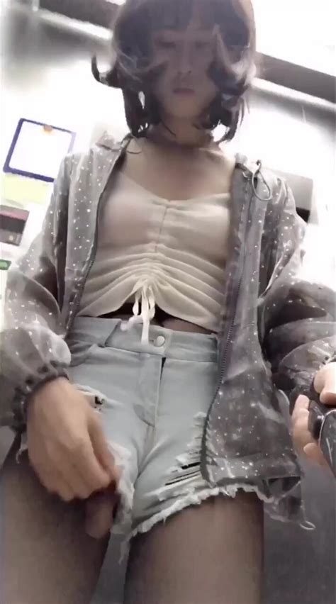 asian tranny with cock hanging out shorts in public