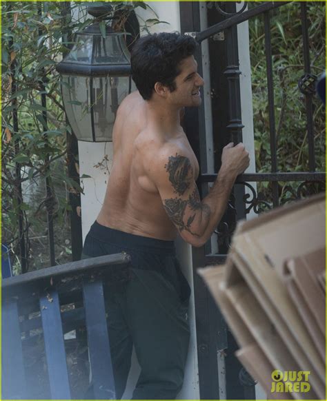 Tyler Posey Goes Shirtless As He Works On His Motorcycle Photo