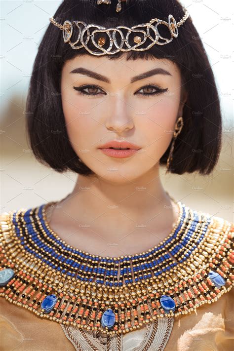 beautiful woman with fashion makeup and hairstyle like egyptian queen