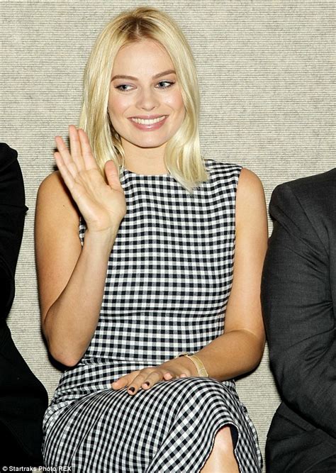 margot robbie wears racy red shoes as she attends the wolf of wall street event with leonardo