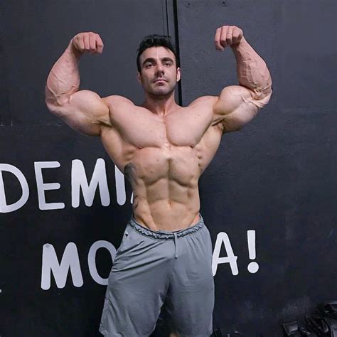massive arms and bulging biceps gym guys muscle men men