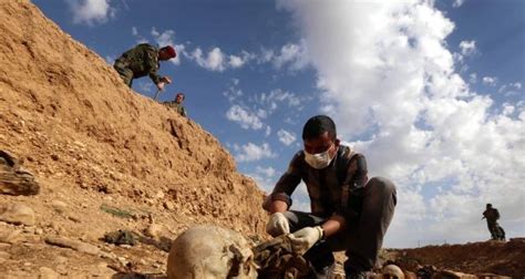bodies of close to 12 000 isis victims from 200 mass graves found in iraq
