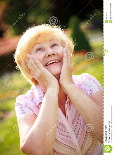 elation ecstasy surprised glad grey haired senior woman looking up royalty free stock images