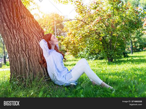 young woman sitting image photo  trial bigstock