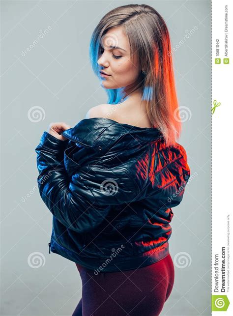 Model Wearing Leather Jacket And Black Skirt Posing