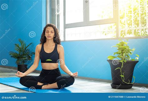 Long Haired Latina Woman Practicing Yoga In A Quiet Space Yoga Lotus