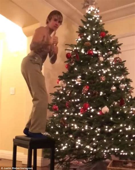 Justin Bieber Decorates His Christmas Tree Shirtless Daily Mail Online