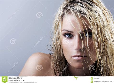 Beauty Portrait Of A Blonde Woman With Wet Hair Stock