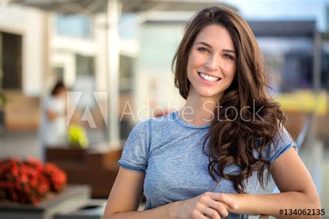 big bright white smile headshot with a beautiful brunette woman sincere happy cheerful positive