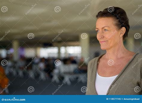 Mature Beautiful Scandinavian Tourist Woman Enjoying Vacation At Stock