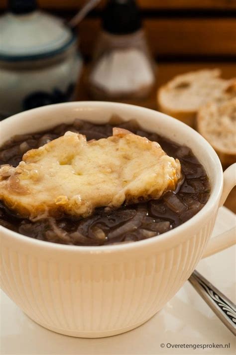 white bowl filled  black beans  bread