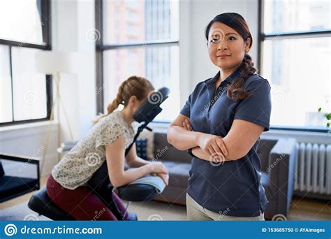 Portrait Of A Chinese Woman Massage Therapist Giving A