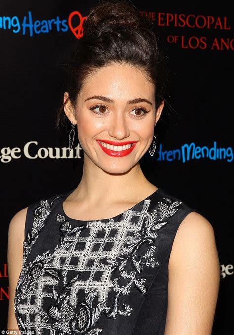emmy rossum stuns in black and white print dress and ruby red lips at