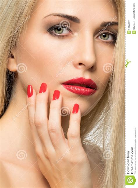 close up portrait of woman lips with red lipstick and red