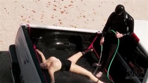 daring babe in full body latex suit gets submerged in water bondage porn