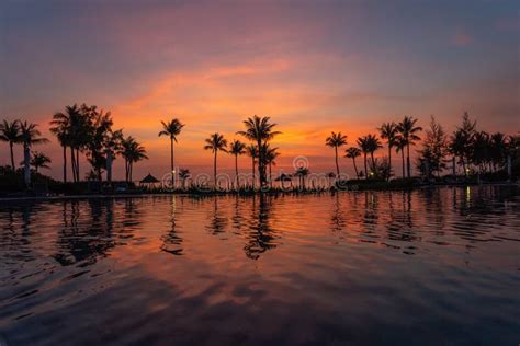 beautiful sunset   swimming pool  luxury resort stock photo