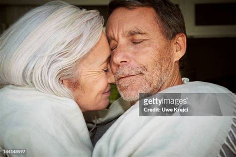 Older Couple Cuddling Photos And Premium High Res Pictures Getty Images