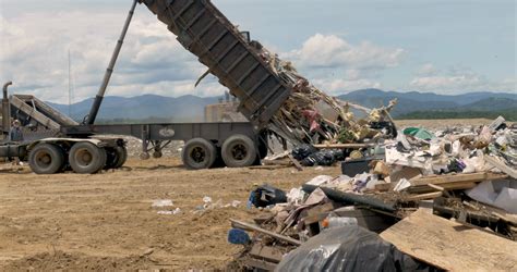 large dump truck emptying dumpster  stock footage sbv  storyblocks