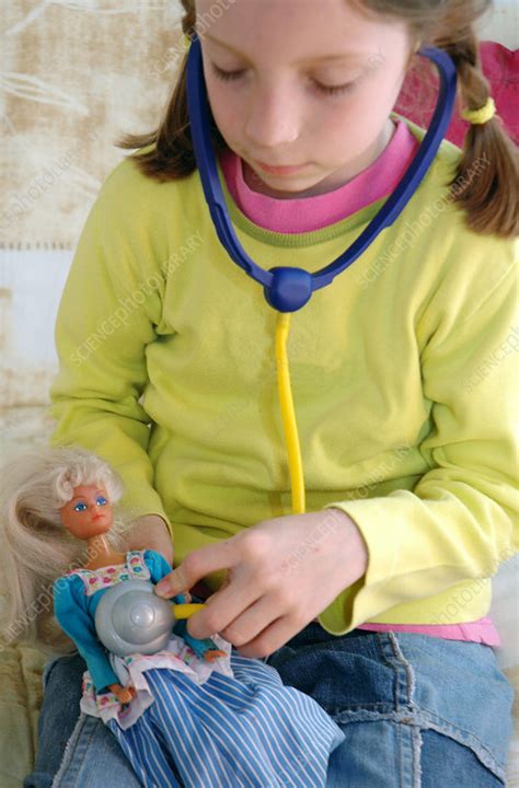 girl playing doctor stock image m830 1798 science photo library