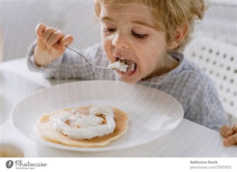 baby eating pancakes