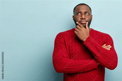 human facial expressions concept contemplative dark skinned guy rubs