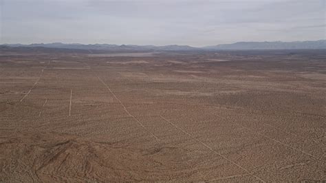 stock footage aerial video pan  open desert  mountains