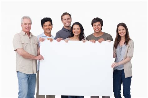 premium photo smiling group holding blank sign