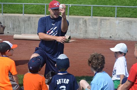 pitching coach cory domel sharing some tips on field day pitching