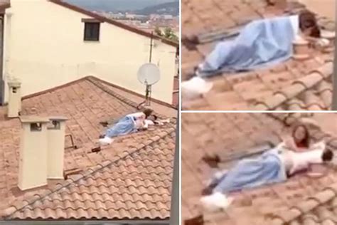randy couple risk their lives romping on crumbling rooftop at pamplona bull run festival
